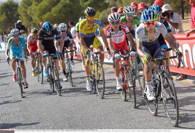 The riders faces showing the pain of the climb in the hot weather