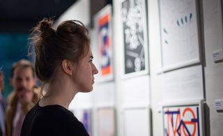 Female looking at posters on the wall