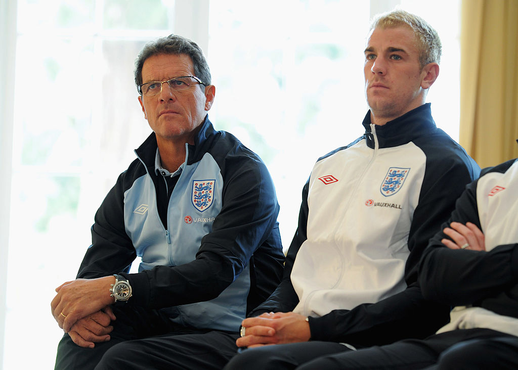 Fabio Capello sits next to Joe Hart in 2011