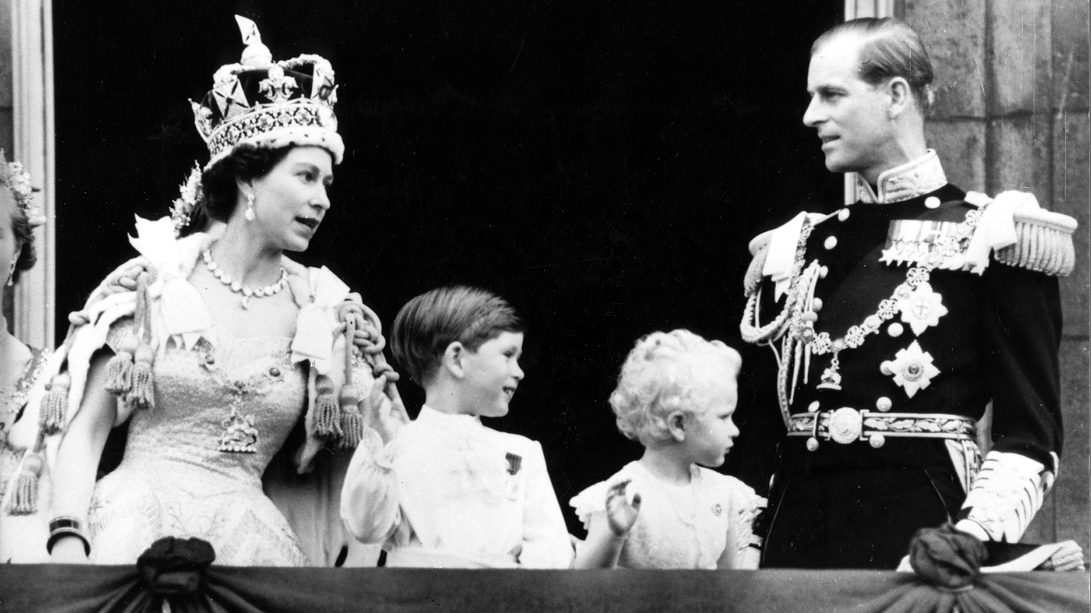 Queen Elizabeth, Prince Philip, Charles and Anne stand on the balcony after the coronation