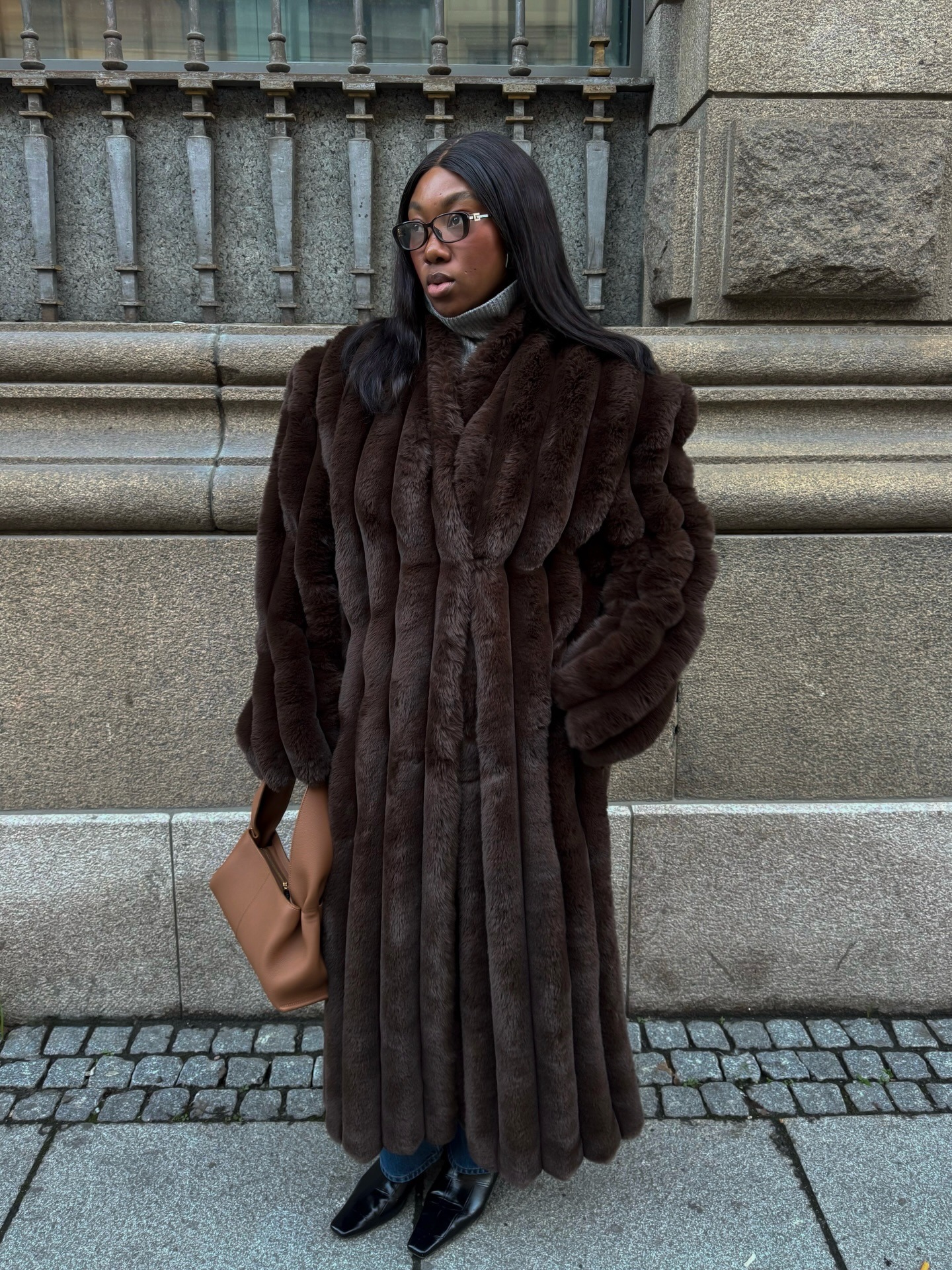 @nnennaechem wears a Helsa long fur coat.