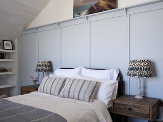light blue wall panelling in bedroom