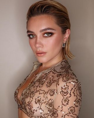 Florence Pugh with slicked back blonde bob hairstyle