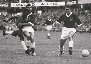 Brazil's Pelé up against two Wales defenders at the 1958 World Cup.