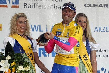 Alessandro Petacchi uncorks the champagne on the podium.