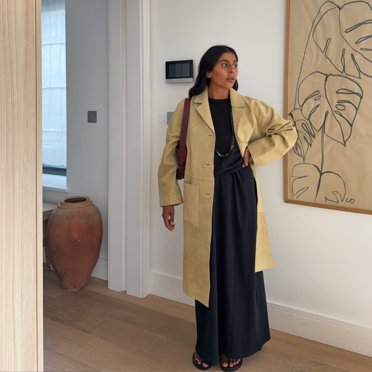 @monikh wears mustard suede trench coat with black dress