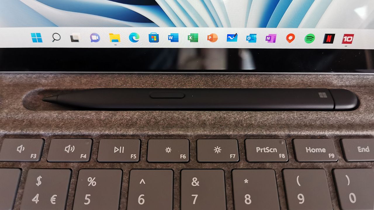 A closeup of the Microsoft Surface Slim Pen 2 in its charging port in the Signature TypeCover