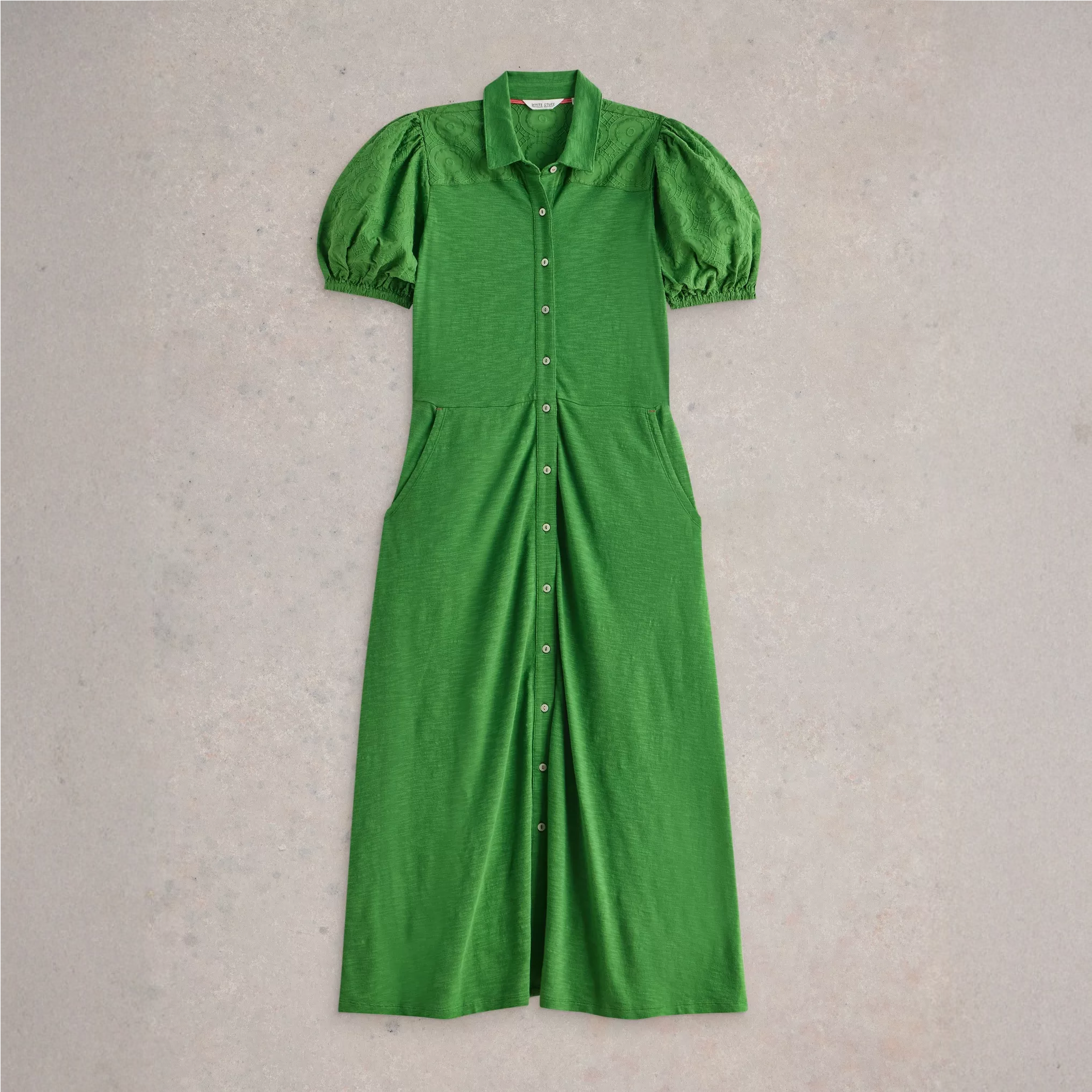 A cutout of a green White Stuff shirt dress