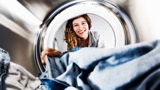 a view of washing and woman outside the washer-dryer from within the washer-dryer drum - why is my washer-dryer not drying