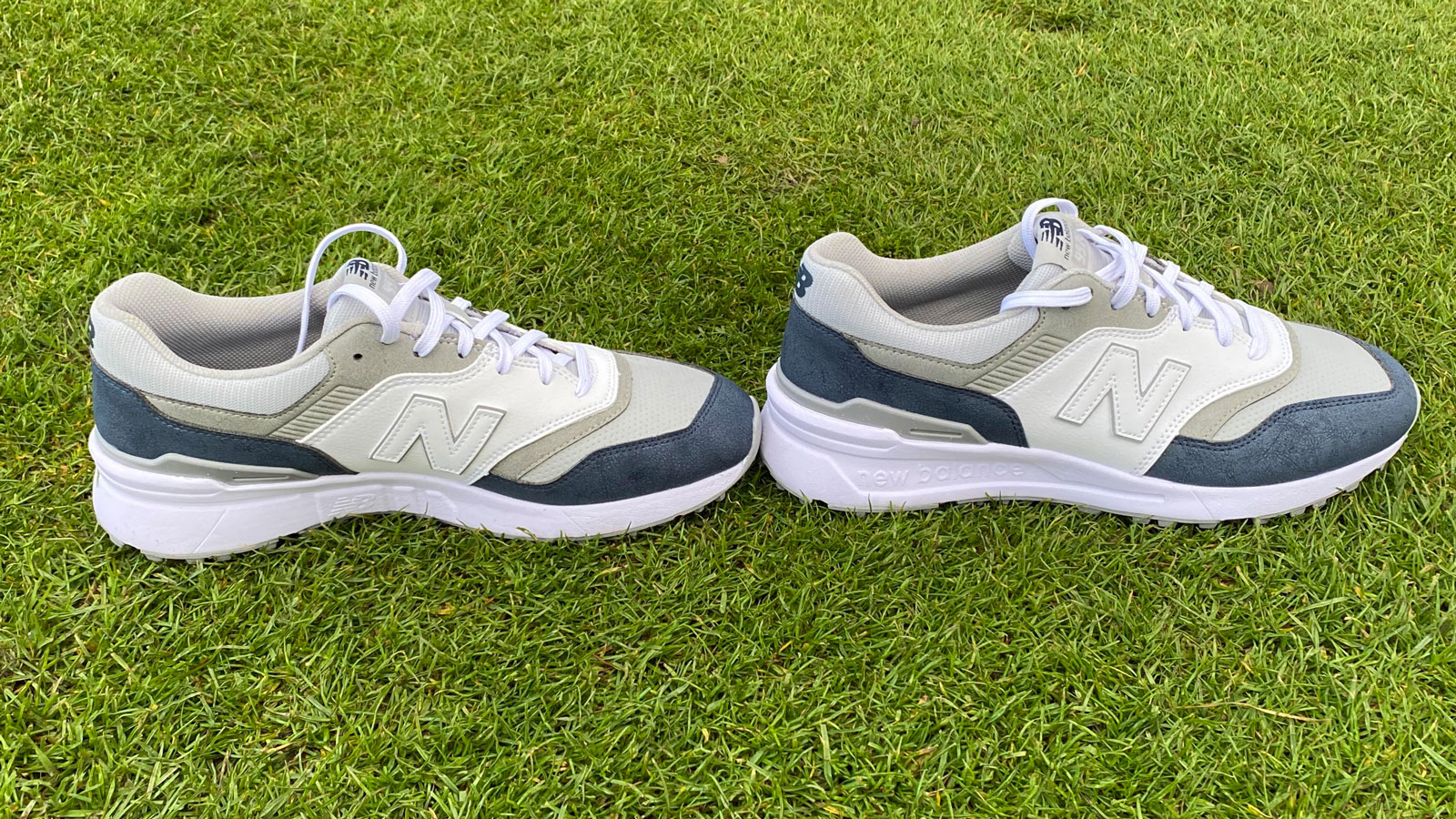 The New Balance 997 SL Golf Shoes side by side