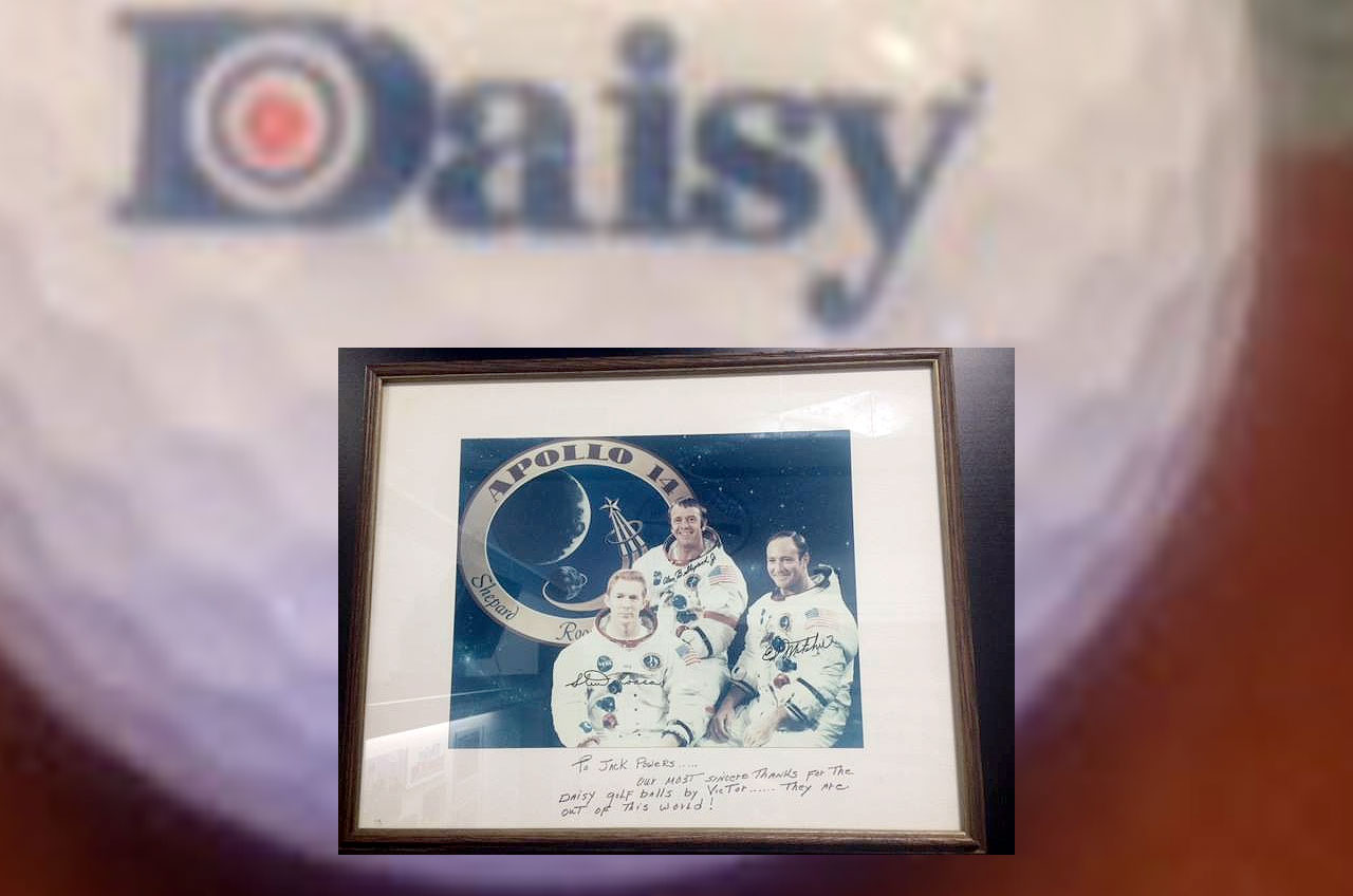 an autographed and inscribed astronaut crew portrait set again an image of a golf ball