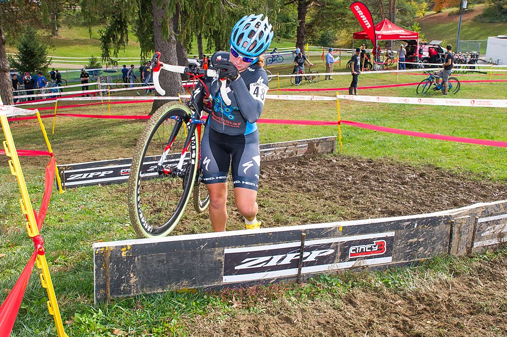 A rider makes her way over the barriers befors heading to the finishing stretch during the closing laps of teh race.