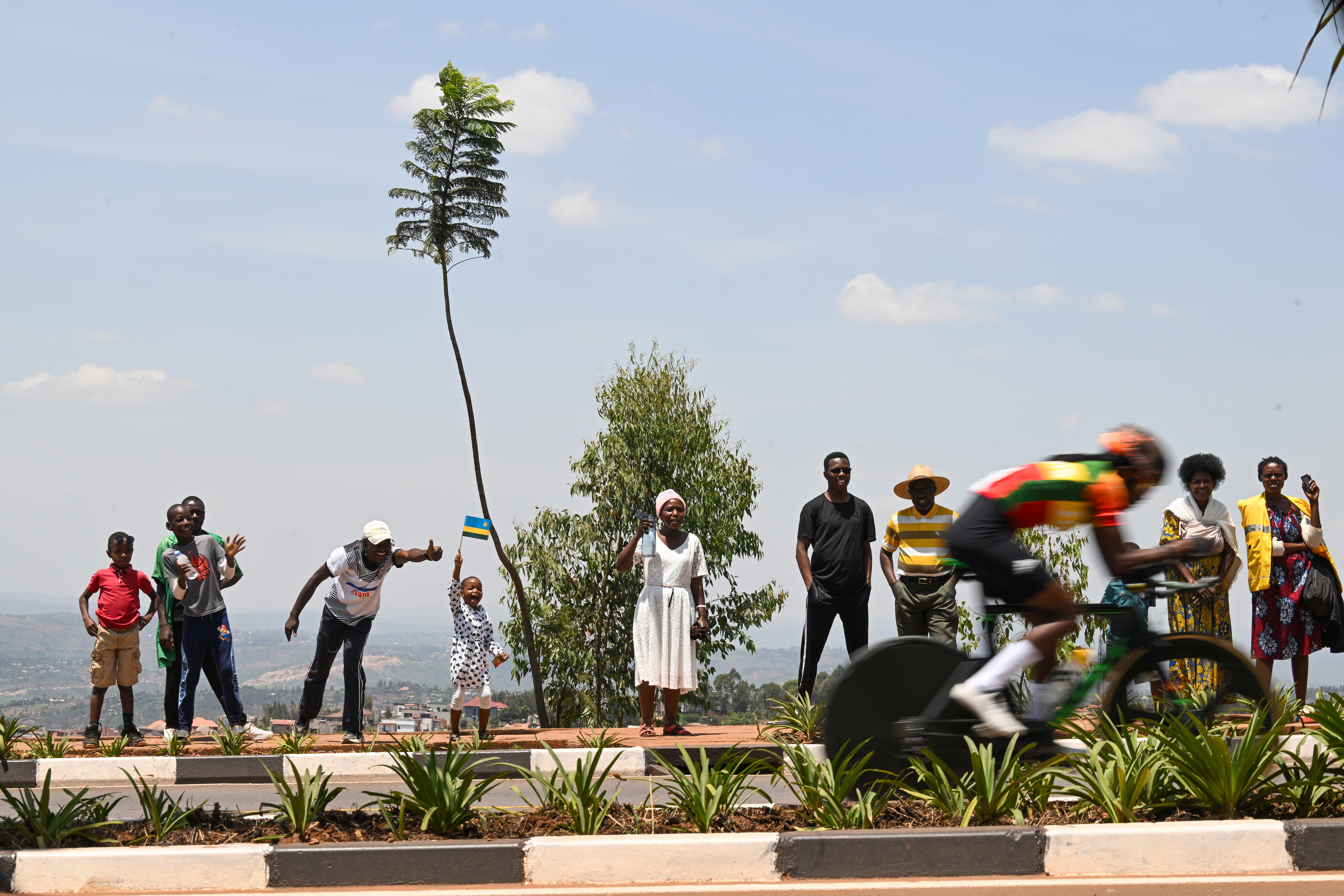 Fkadu Brhan Abrha of Ethiopia passes fans at the roadside
