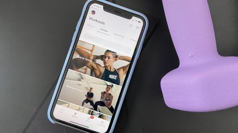 A photo of a phone with the Nike Training Club app