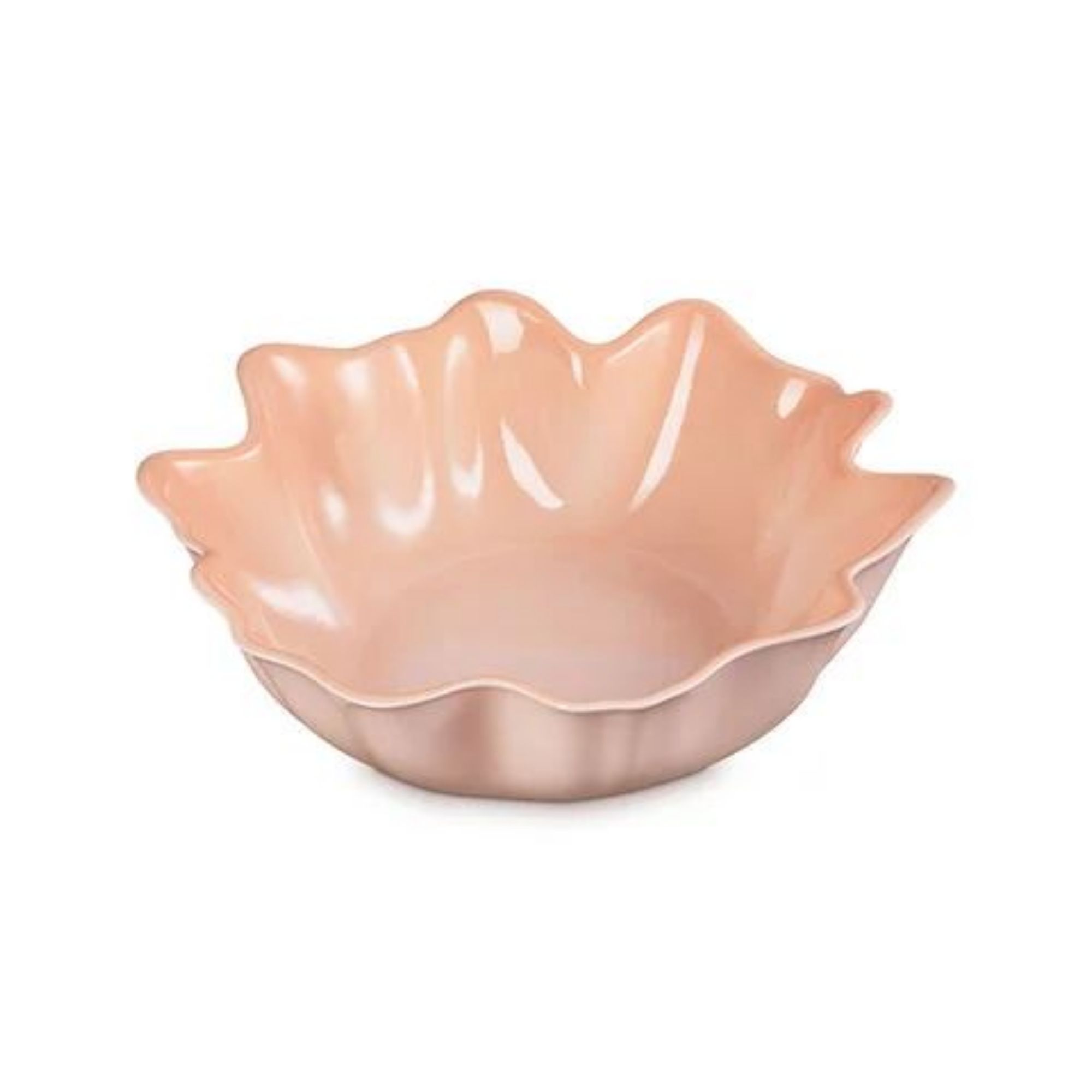 An asymmetrical serving bowl in peach.