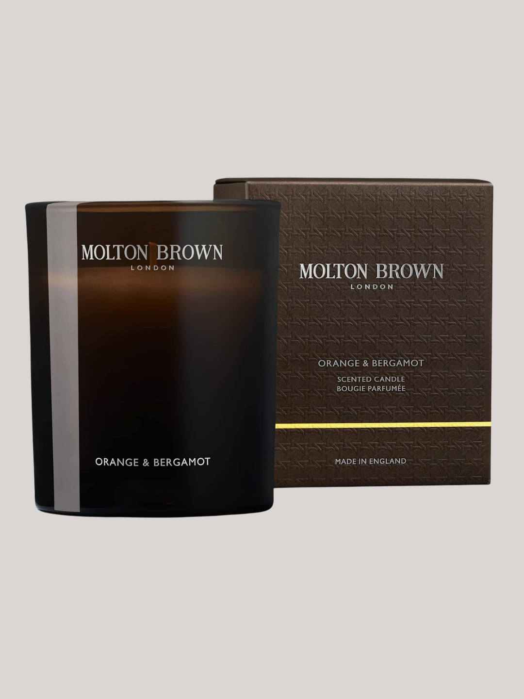 A brown orange and bergamot glass candle from Molton Brown