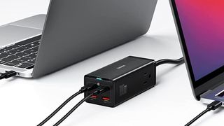 Baseus PowerCombo Series 100W Hybrid GaN Charger charging a MacBook Pro and MacBook Air