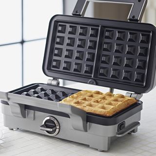 Cuisinart waffle maker being used to make waffles