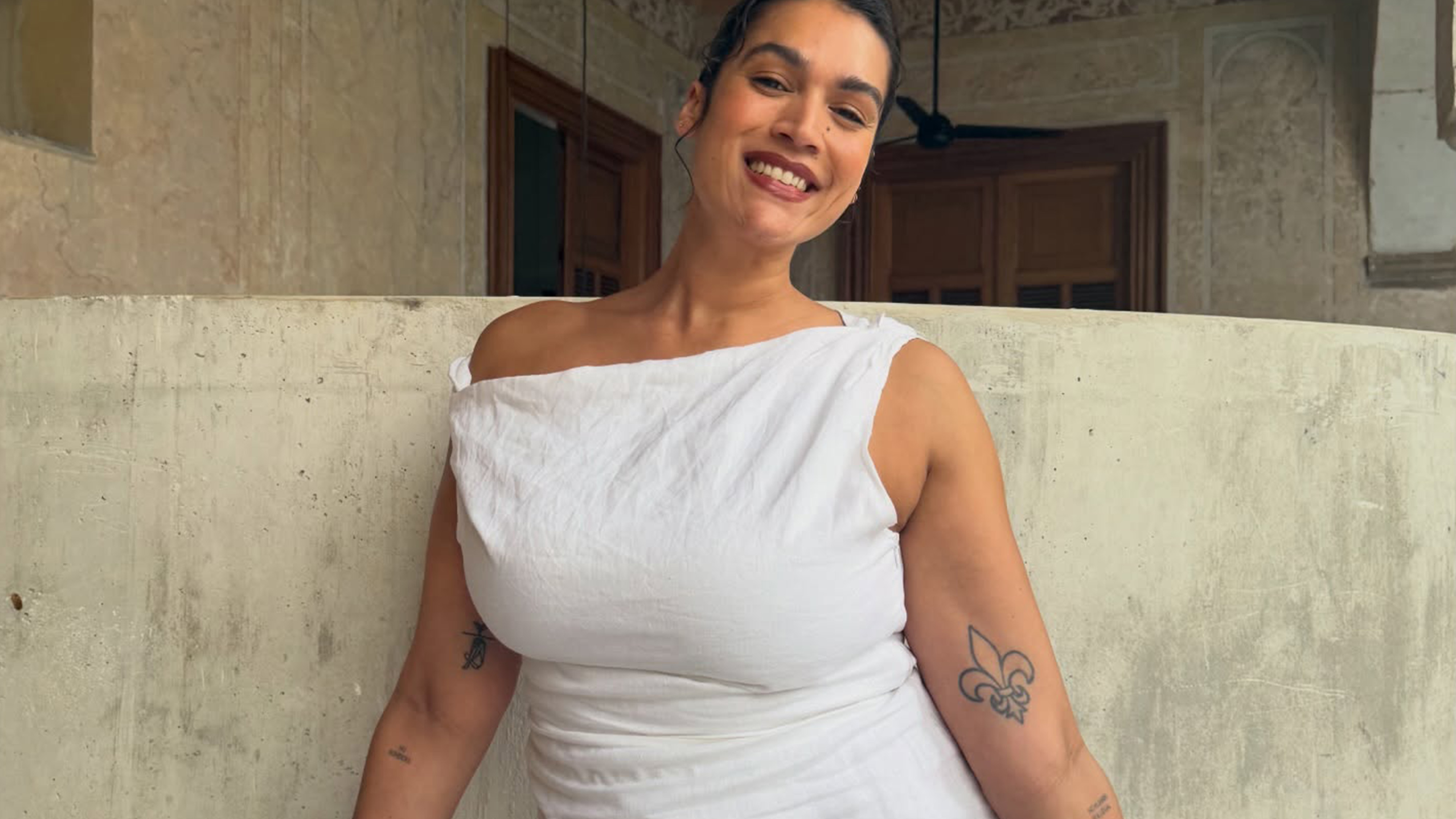 Jennifer Atilemile wearing a white dress.