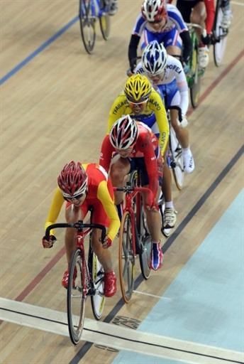 Xin Liu (People's Republic of China) crosses the finish line first in the points race's final sprint.