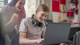Are 4K laptops worth it? image shows two teenagers gaming on a laptop