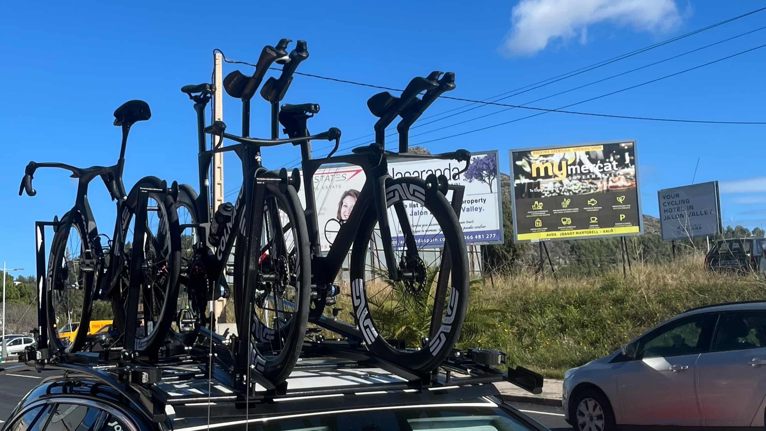 Colnago time trial bikes on a car roof 