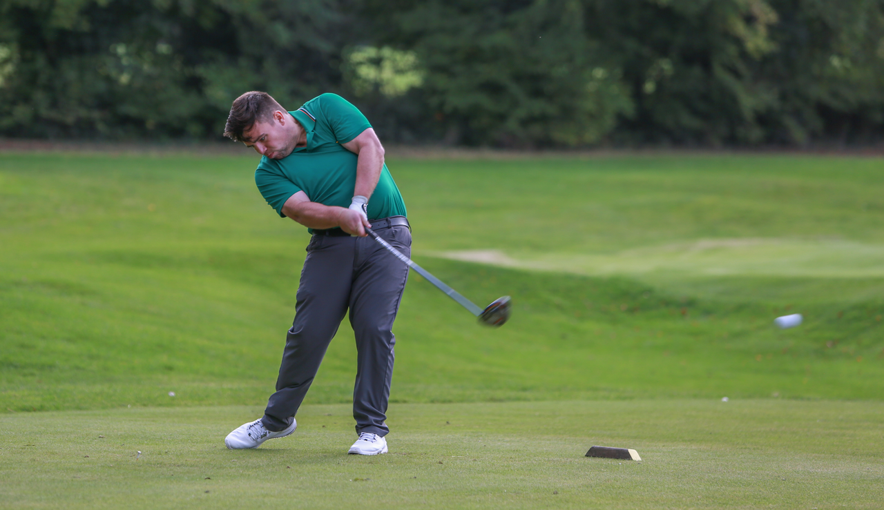 Matt Cradock hits a tee shot with a driver