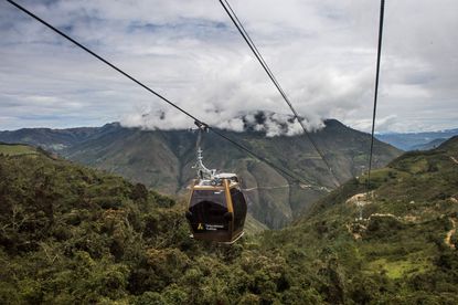 Tourists use a new cable car system to reach Kuelap, a fortified citadel built by the Chachapoya indigenous people between the 6th and 11th centuries, from the town of Nuevo Tingo, in the Ama