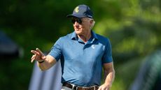 Greg Norman waves to the crowd at LIV Golf Singapore 2024
