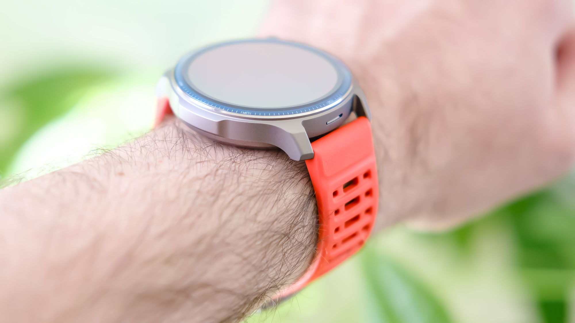 Close-up of the Amazfit Balance 2 smartwatch on an orange rubber strap