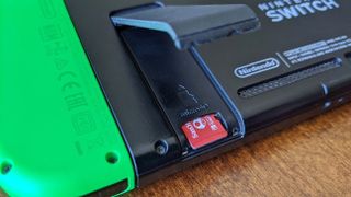 MicroSD card in Nintendo Switch under kickstand.