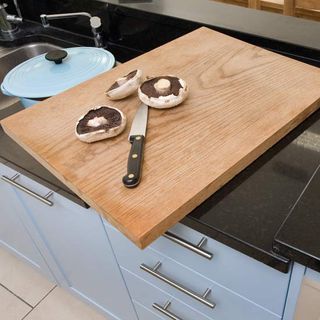 blue kitchen with chopping board and knife