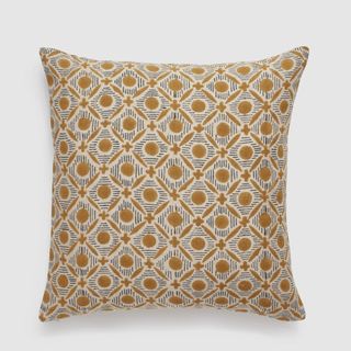 gold patterned square cushion