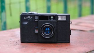 Lomography Lomo MC-A camera on a brick wall