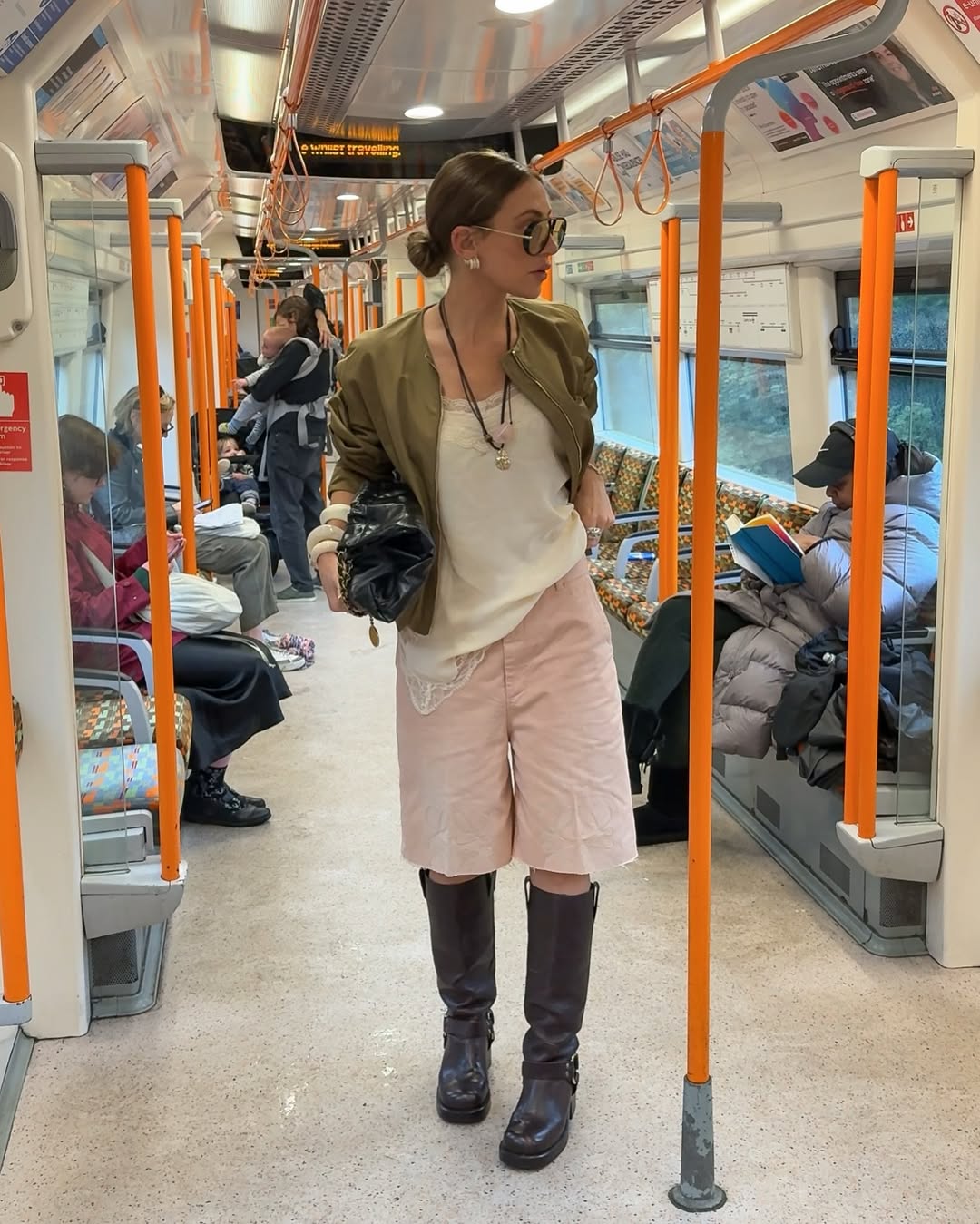 Agnes Pusztai wears pink long shorts, boots and cami top