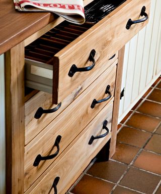 Kitchen drawers freestanding furniture terracotta tiled floor real home