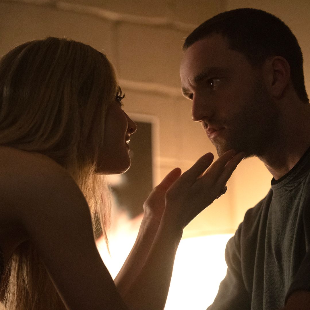 a young woman touches a man&#039;s chin as they lean in for a kiss in tell me lies season 3