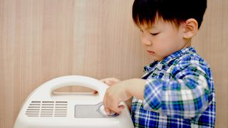 Is dehumidifier water safe to drink: image shows dehumidifier and child