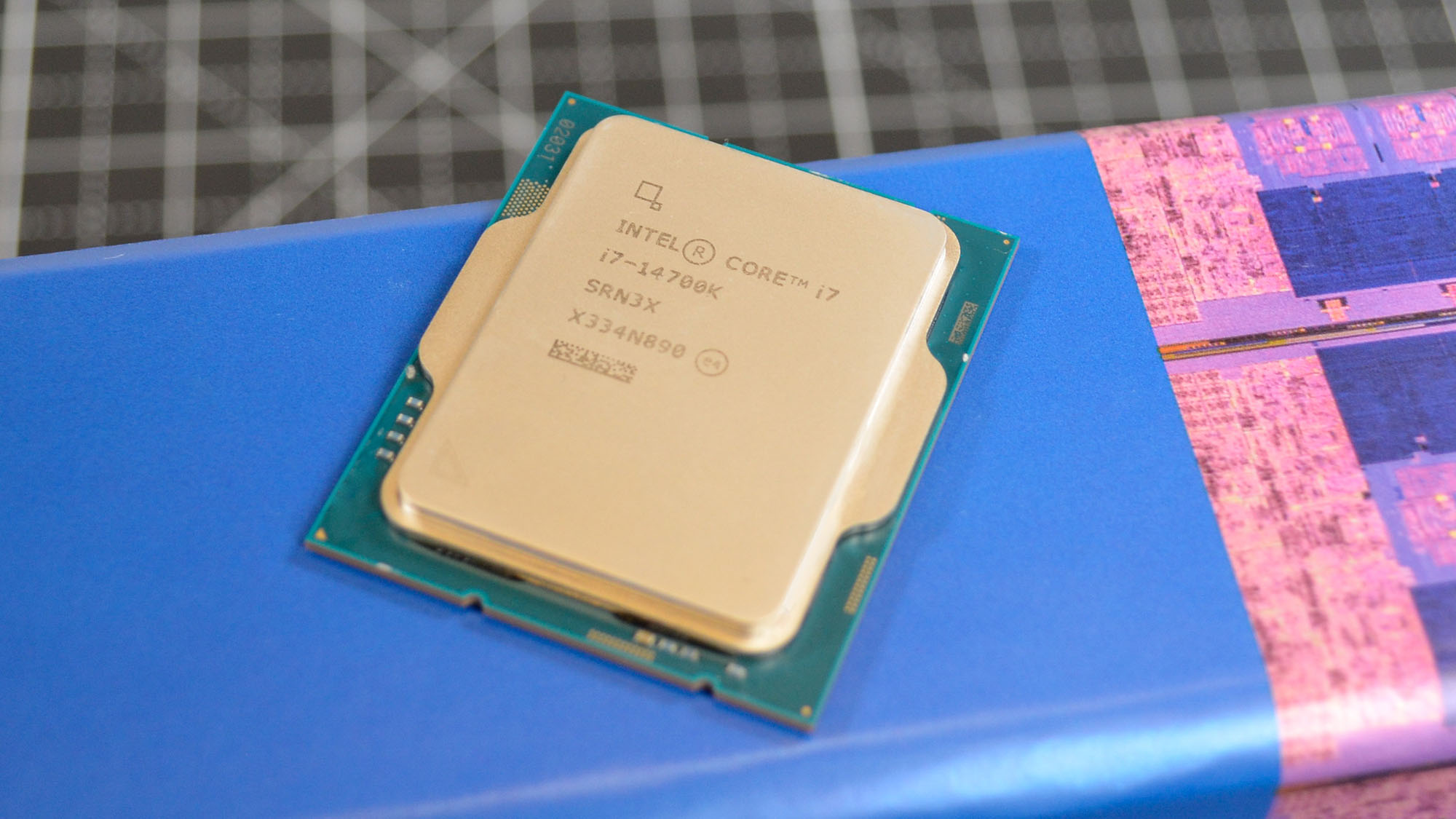 An Intel Core i7-14700K with its promotional packaging