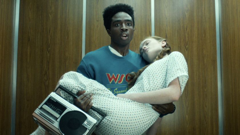 Lucas Sinclair (Caleb McLaughlin) carries Max Mayfield (Sadie Sink) in Stranger Things.