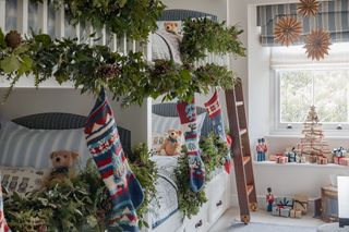 four bunk room with christmas garlands