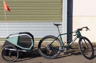 Thule Bexey Dog Trailer attached to bike outside industrial unit