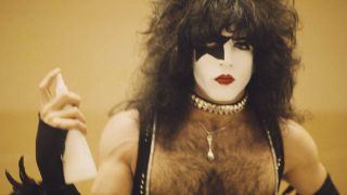 Paul Stanley with a bottle of hairspray, 1977