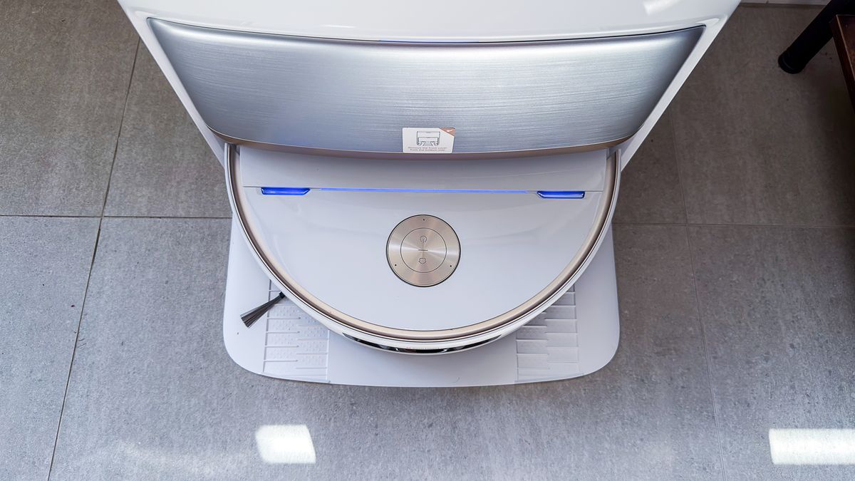 Mova V70 Ultra Complete robot inside its dock with blue charging light indicator
