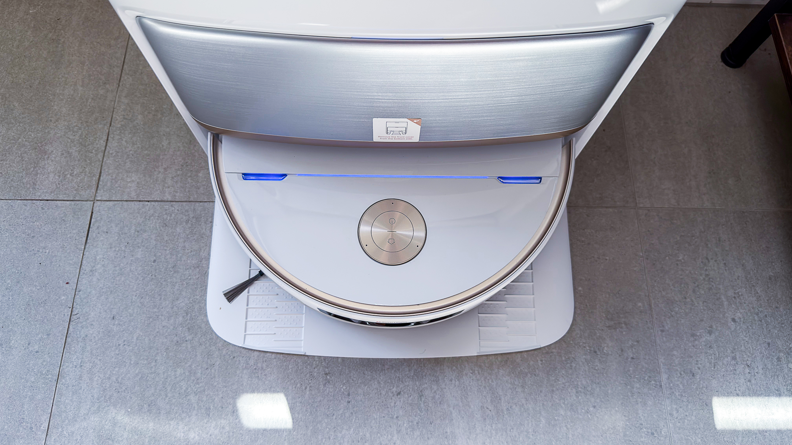 Mova V70 Ultra Complete robot inside its dock with blue charging light indicator