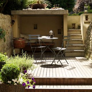 back garden with wooden flooring and cushion