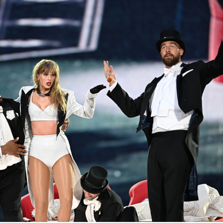 Taylor Swift and Travis Kelce on stage tribute