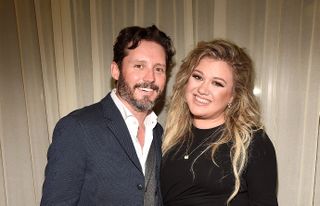 Brandon Blackstock and Kelly Clarkson backstage after she performed songs from her new album "The Meaning of Life" at The Rainbow Room