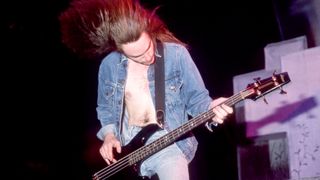 Bass guitarist Cliff Burton (1962-1986) plays on stage during the Damage, Inc. Tour on July 21, 1986 at Pine Knob Music Theatre in Clarkston, Michigan.