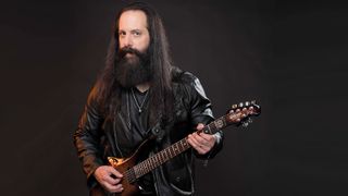 John Petrucci, photographed in New York City December 12, 2018, with a six-string Tiger Eye Ernie Ball Music Man Majesty